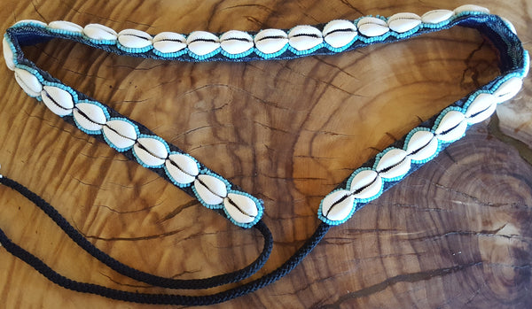 Single row cowrie shell belt with turquiose blue seed beeds detail