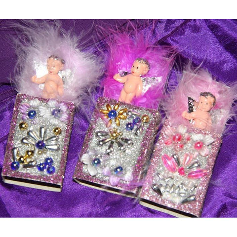 Thumberlina Fairy doll in a little matchbox bed decorated with beads glitter